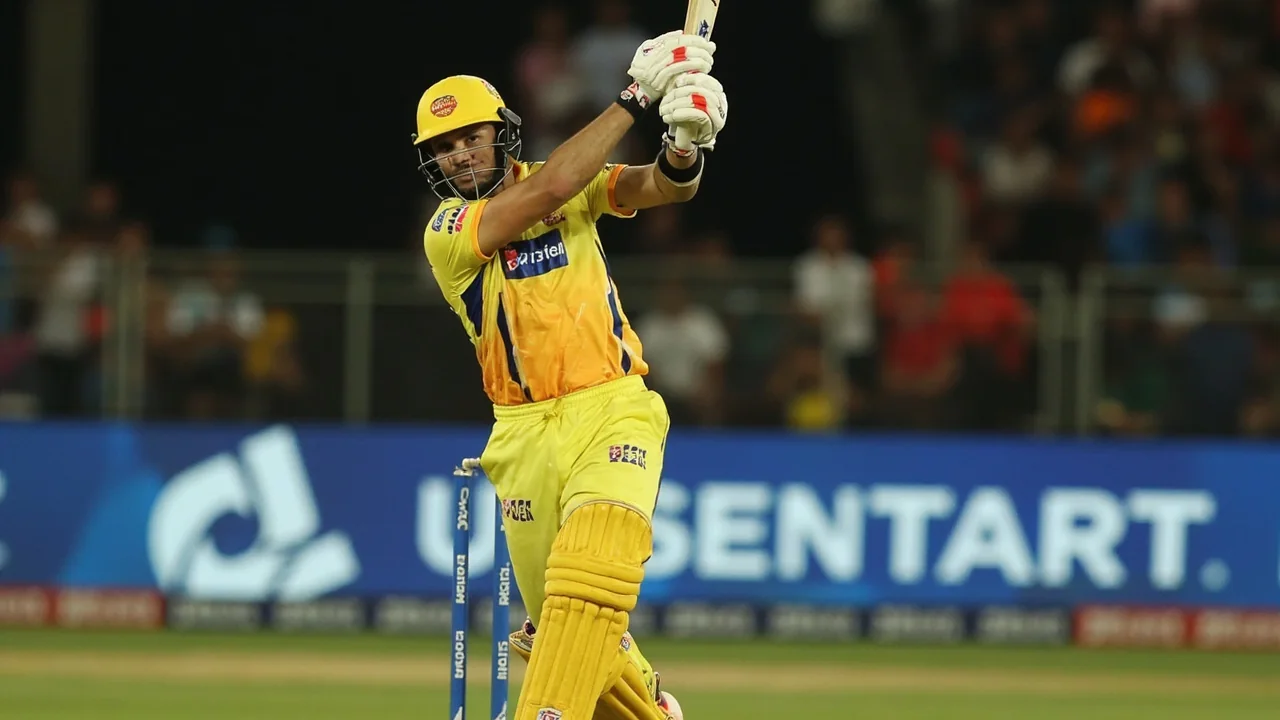 Tight sideline view of an IPL batter in stance on a slow subcontinental surface with close-in fielders visible behind the bat
